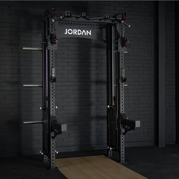 A black Jordan J75 Cable Rack integrated dual pulley system with accessories, including J-Hooks and a multi-handle pull-up bar, designed for cable and free weight workouts.