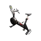 Commercial grade upright exercise bike with a backlit display, black and gray color scheme, with adjustable seat and handlebars.